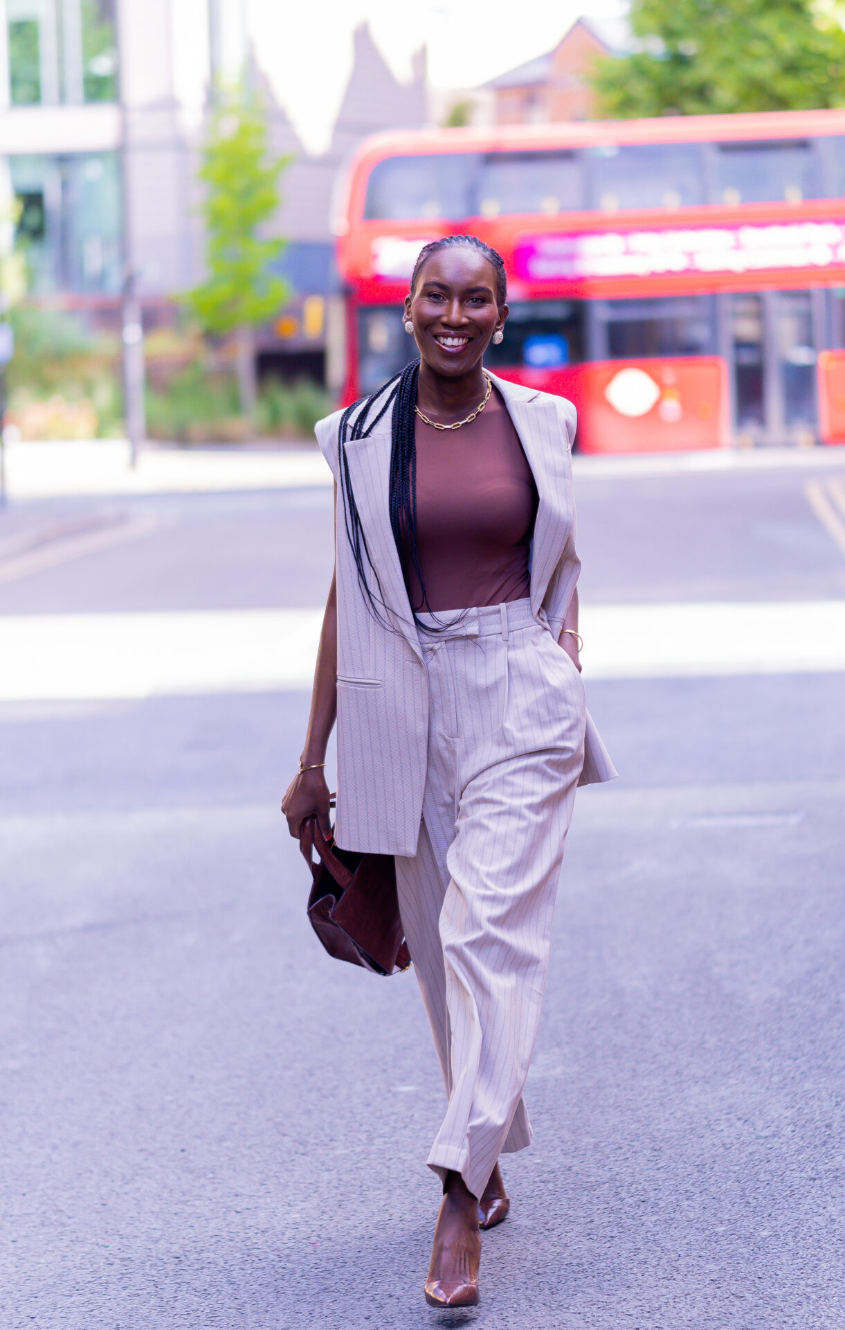 How to dress for the office during a heatwave with a chic linen sleeveless blazer and tailored trousers outfit.